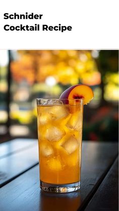 a glass filled with ice and fruit on top of a wooden table