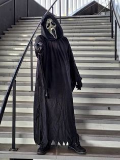 a man dressed as darth vader on the stairs