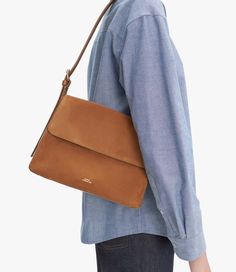 A.P.C. Women's bag.- Bag in smooth leather and suede.- Leather panel.- Inside pocket.- Small pouch attached to the base.- Adjustable leather strap.- Can be carried on the shoulder.- Goldtone hardware.- Embossed goldtone A.P.C. logo on the small interior pouch.- Embossed goldtone ""A.P.C. Rue Madame Paris"" logo." Sling Bag Mini, Leather Panel, Paris Logo, Accessories Bags Shoes, Faux Leather Bag, Exclusive Clothing, Small Pouch, C Logo, Denim Accessories