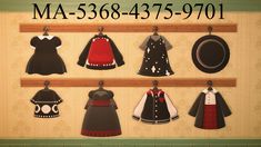 there are many different dresses hanging on the wall in this display case, which includes hats and aprons