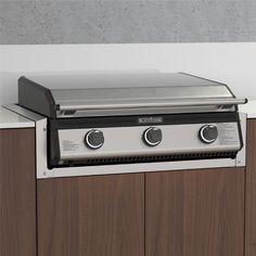 an outdoor grill with two burners on the top and one in the bottom part