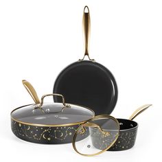 three pots and pans are shown with gold stars on the bottom one is black