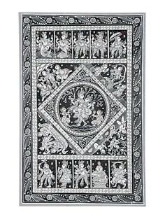 an intricately decorated wall hanging in black and white, with figures on the side