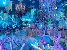 a room filled with lots of purple and blue decorations