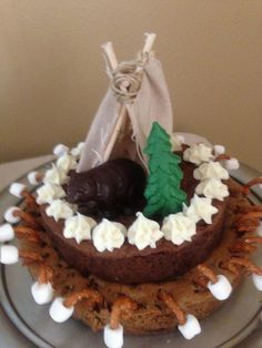 a chocolate cake with white frosting and decorations