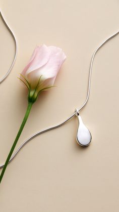 A tear-shaped pendant in recycled sterling silver on a snake chain. A Snake, Recycled Sterling Silver