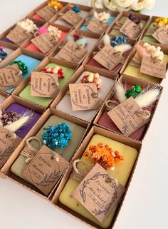 a box filled with lots of different types of soaps on top of a table