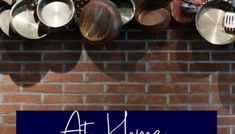 pots and pans hanging on a brick wall with the words at home cooking tips