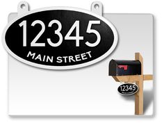 a mailbox with the number 12345 on it next to a sign that says main street