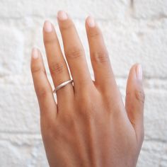 The Silver Crescent Moonface Ring from Anthony Lent has a sparkly white diamond eye. His realistic face and dreamy matte silver finish point to Anthony's fascination with Renaissance astronomy and how art and science combine. This piece looks especially great layered with other celestial rings. Stone: White Diamonds, Total .02tcwMetal: Sterling SilverMeasurements: Moon length: 13mm, Moon height: 5mm, Band width: 2mm Shipping and Delivery: IN STOCK items will ship within 2 business days Sizes not Modern White Diamond Ring For Everyday, Modern Everyday White Diamond Ring, Silver Minimalist Diamond Ring, Minimalist Silver Diamond Ring, Modern Silver Diamond Ring For Everyday, Minimalist Si Clarity Diamond Wedding Ring, Minimalist Silver Diamond Ring For Everyday, Minimalist Platinum Diamond Ring, Minimalist Everyday Silver Diamond Ring