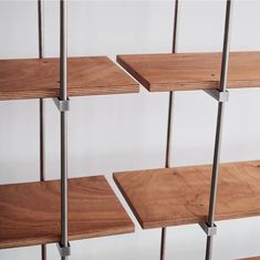 the shelves are made out of wood and metal