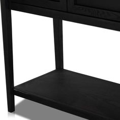 a black wooden table with two drawers and one shelf on the bottom, against a white background