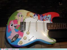 an electric guitar decorated with cartoon characters