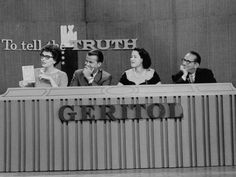 four people sitting at a desk in front of a sign that says geritoo