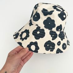 Perfect for a day of fun in the sun, our bucket hat is structured with an extra-wide brim to keep you cool and covered on the go. 100% cotton canvas screen printed with water-based inks Made in California Brim: 3.5" Circumference: 23" To clean: spot clean and/or dry clean. Pre-washed Cotton 5-panel Hat, Playful Cotton Sun Hat For Spring, Playful Cotton Sun Hat For Outdoor, Playful Cotton Outdoor Hat, Playful Cotton Hats With Upf 50+, Playful Cotton Hat With Upf 50+, Adjustable Cotton Bucket Hat In Playful Style, Playful Adjustable Cotton Bucket Hat, Playful Cotton Bucket Hat With Short Brim