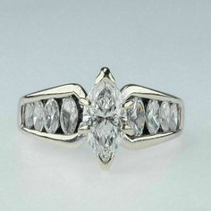 an engagement ring with three pear shaped diamonds