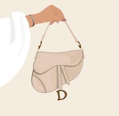 a hand holding a purse with the letter d on it