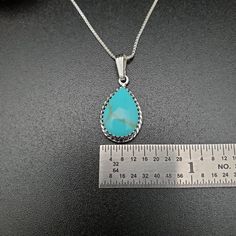 "Visit our on-line shop at: Etsy.com/shop/AlbuquerqueDesigns *sterling silver necklace pendant *pendant with silver box chain necklace 18\" *southwestern jewelry *turquoise / kingman turquoise *calibrated pre-cut stones: 15x10mm teardrop shape *all jewelry items are made to ship, slight variations in stones will occur comparing to pictures *size of a penny is 19mm or a dime is 18mm in diameter for comparing size with jewelry items *handcrafted in USA *free convenient gift box *free shipping in U Sterling Silver Turquoise Teardrop Necklace, Southwestern Silver Turquoise Teardrop Pendant Necklace, Southwestern Turquoise Sterling Silver Necklace, Southwestern Blue Teardrop Pendant Necklace, Sterling Silver Turquoise Teardrop Necklace For Jewelry Making, Southwestern Sterling Silver Teardrop Turquoise Necklace, Southwestern Turquoise Teardrop Pendant Necklace, Nickel-free Teardrop Turquoise Sterling Silver Necklace, Nickel-free Teardrop Turquoise Necklace In Sterling Silver