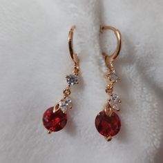 Red White Cz 18k Gold Plated Earrings Red Elegant Round Hoop Earrings, Elegant Red Round Hoop Earrings, Elegant Red Hoop Earrings For Formal Occasions, Red Gold Plated Drop Earrings, Red Gold Plated Earrings For Party, Red Gold-plated Pierced Jewelry, Red Cubic Zirconia Earrings For Gift, Red Drop Earrings Fine Jewelry, Red Single Earring Fine Jewelry