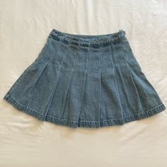 Denim Pleated High Waist Mini Tennis Skirt. Never Worn. Casual Light Wash Denim Skort, Casual Medium Wash Denim Skort, Casual Denim Skort For Day Out, Blue Denim Skort For Day Out, Spring Blue Denim Skort, Blue Pleated Mini Denim Skirt, Blue Mid-rise Cotton Skort, Denim Pleated Skort, Short Length, Mini Denim Pleated Skirt