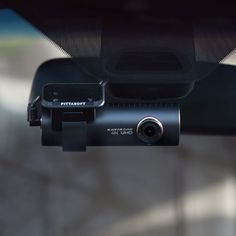 the dash camera is attached to the rear view mirror