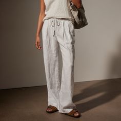 Our Wide Leg Relaxed Linen Pant is made in our classic lightweight linen that is breathable and soft. Style details include narrow jersey waistband with drawcord, front pleats, slash front pockets, back pockets, back darts, and a clean bottom hem. Garment dyed. Relaxed fit.Additional Information:• 100% Linen • Machine wash cold, tumble dry lowStyled With:• WVP3032 - Cotton Linen V Neck Vest • SWTSU8427 - Women's Suede Buckle Slide Linen Drawstring Pants, Linen Pant, Wide Leg Denim, Denim Pant, Linen Pants, Soft Style, Cotton Linen, Black Pants, Lookbook