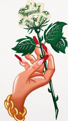 a woman's hand holding a flower with green leaves and gold chains on it