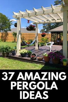 an outdoor pergola with flowers and plants on the ground in front of it