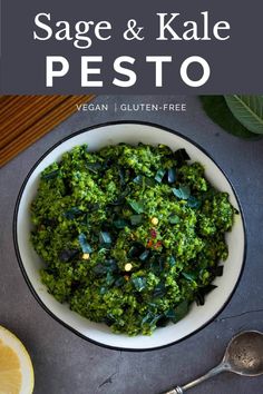 pesto de salvia and kale in a bowl with lemon wedges on the side