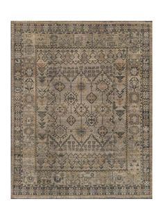 an antique style rug with many different colors and patterns on the front, in neutral tones