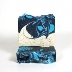 a blue and white soap bar sitting on top of each other