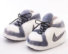 Description: Comfy and cozy athletic-style slippers designed to mimic the look of classic sneakers, perfect for lounging in style. Features a plush, soft exterior in white and grey, offering maximum warmth and comfort for your feet. Perfect for lounging at home, sleepovers, or as a fun gift for sneaker lovers. ONE SIZE- Fits ages 6 and up Length: 12 inches Width: 6 inches Material & Care: Fabric: Plush synthetic fabric with cushioned interior. Care Instructions: Spot clean or hand wash as needed Nike Slippers, Grey Jordans, Cute Nike Outfits, Preppy Shoes, Pretty Shoes Sneakers, All Nike Shoes, Shoe Wishlist