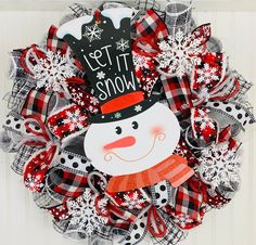 a wreath with a snowman on it