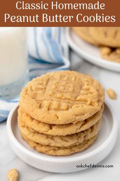 peanut butter cookies stacked on top of each other in front of a glass of milk