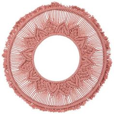 a pink doily on a white background with a circular hole in the middle that has been crocheted