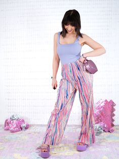 "Introducing the \"Psychedelic Bubblegum Pink Pleated Pants\"! 💖 You'll be the epitome of fabulousness in these bubblegum pink beauties, made with a dash of pixie dust and a sprinkle of sass, these pants will have you strutting your stuff like it's Woodstock all over again. With every step, you'll radiate retro vibes and spread joy like confetti. Whether you're hitting the dance floor or just lounging around, these pants scream \"party on my legs\"! Soft as silk pleated fabric with an intricate Trendy Pink Bottoms For Pajama Party, Playful Pink Bottoms For Spring, Trendy Pink Pants For Pajama Party, Playful Pink Bottoms For Pajama Party, Pink Wide Leg Pants For Pajama Party, Playful Pink Pants For Pajama Party, Pink Pants For Pajama Party In Summer, Purple Bottoms For Pajama Party In Spring, Purple Bottoms For Spring Pajama Party