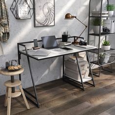 a computer desk sitting on top of a wooden floor