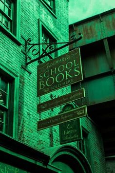 there are many signs on the side of this building that say school books so little time