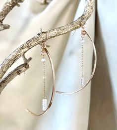 "This pair of dramatic earrings swing gracefully from the ear. They are bronze arcs in a crescent moon shape accented by a length of chain ending in gemstones(the stars!). The effect is ethereal. Available in rainbow moonstone or pyrite gems. Ear wires are 14k gold filled or sterling. Length is approx. 3.25\"." Silversmith Jewellery Backyard Silversmiths Jewelry, Elegant Crescent Metal Jewelry, Elegant Crescent Shaped Metal Jewelry, Elegant Crescent-shaped Metal Jewelry, Elegant Moon Charm Drop Earrings, Elegant Half Moon Brass Jewelry, Elegant Half Moon Metal Earrings, Elegant Half Moon Gold Hoop Earrings, Elegant Brass Jewelry With Moon Charm