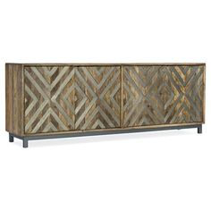 a wooden sideboard with geometric designs on it