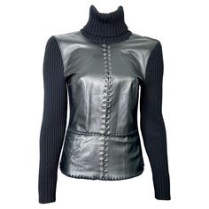 Paco Rabanne 2000s rollneck sweater in ribbed wool with riveted leather yoke at center joined by an interlaced leather lace. Warm, wearable and unlined, this sweater will give your outfit a chic, Rock edge. Size 42, please refer to measurements Shoulder width 40cm Chest width 44cm Waist 36cm Hips 40cm Length 60cm Sleeve length 64cm. In very good vintage condition Fitted Leather Top For Winter, Rollneck Sweater, Roll Neck Sweater, Paco Rabanne, Leather Lace, Leather And Lace, Sweater Outfits, Sleeve Length, Fashion Outfits