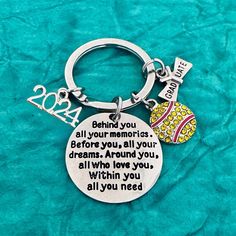 a keychain with a quote on it that says, behind you all your moms