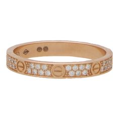 A vintage Cartier diamond mini Love ring set in 18k rose gold. The Love collection is a firm favourite of many mainly due to the simple yet beautiful design. This particular love ring is from the Love ring collection and is the small model. It is composed of a 2.6-millimetre band with eight individual nail motifs engraved around the band. Between each nail motif are two row of pave set diamonds adding the perfect sparkle to the piece. The ring can easily be worn for every day as a standalone pie Cartier Diamond, Cartier Love Ring, Mini Love, Cartier Jewelry, Ring Collection, Cartier Love, Love Vintage, Eternity Ring Diamond, Love Ring