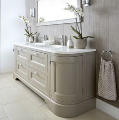 a bathroom with two sinks and a mirror