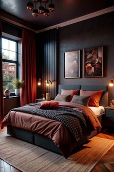 a bedroom with black walls and red bedding in the corner, along with two lamps on either side of the bed