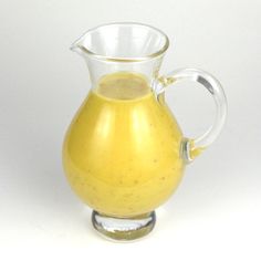 a pitcher filled with liquid sitting on top of a table