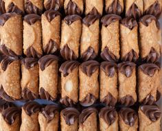 chocolate covered cookies are arranged in rows on a tray