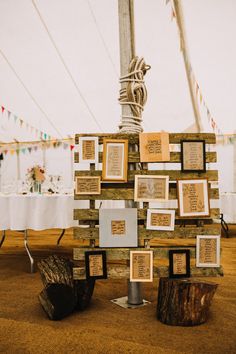 there is a wooden structure with pictures on it