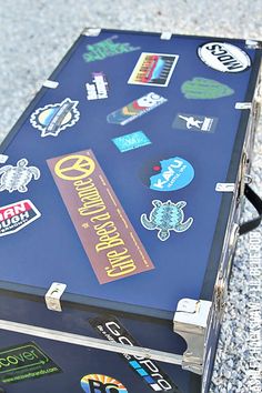 a piece of luggage that has various stickers on it