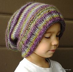 a small child wearing a knitted hat